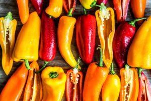 Colorful peppers on rustic background